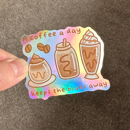 A coffee a day keeps the blues away Holographic Die Cut Sticker